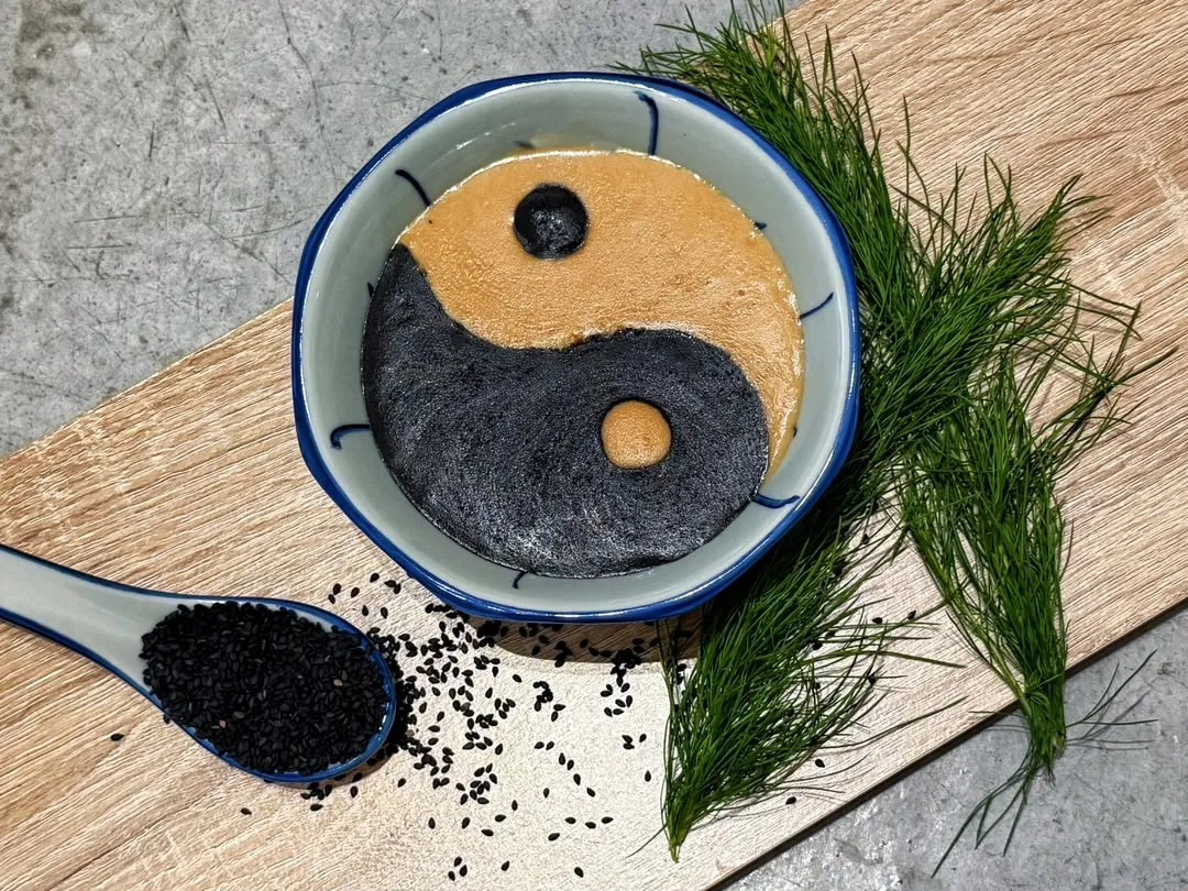 Yin-Yang Paste at Tang Xu Dessert House in Gunung Rapat, Ipoh: black and golden sweet pastes swirled into a taiji symbol, with a spoon of black sesame seeds